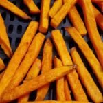 Froozen sweet potatoes in a hot air-fryer