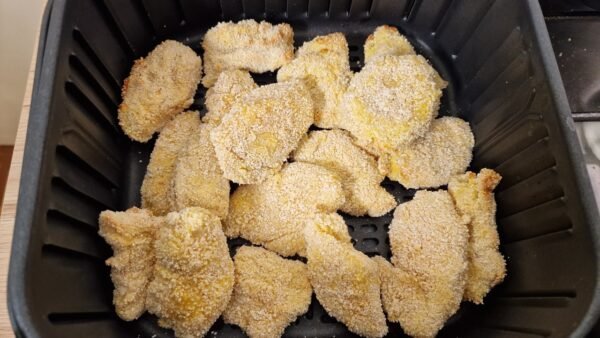 Parmesan chicken nuggets in air fryer before frying