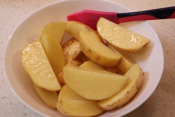 Preparing air fryer baked potatoes 2